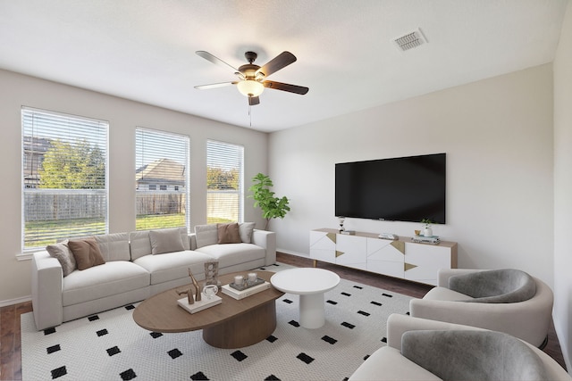 living room with hardwood / wood-style flooring and ceiling fan