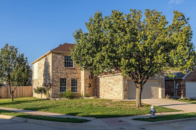 view of front of house featuring a garage and a front lawn