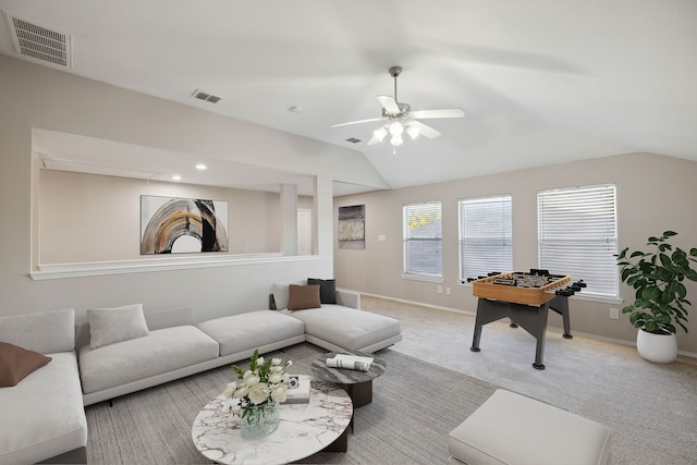 living room featuring carpet, ceiling fan, and lofted ceiling