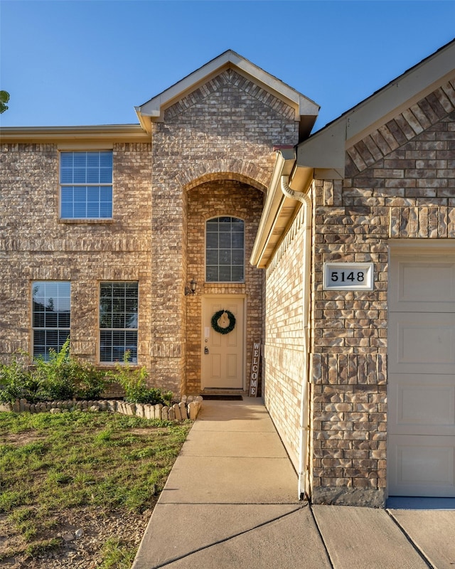 property entrance with a garage