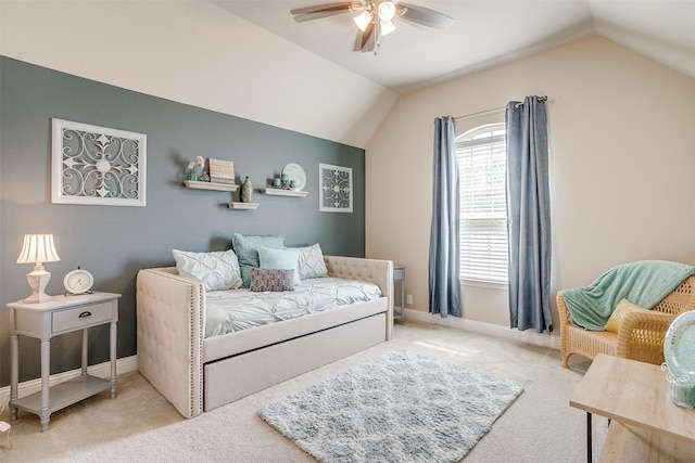 carpeted bedroom featuring lofted ceiling and ceiling fan