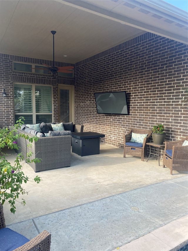 view of patio featuring an outdoor living space and ceiling fan