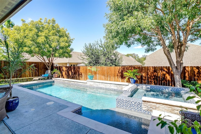 view of pool with a patio and an in ground hot tub