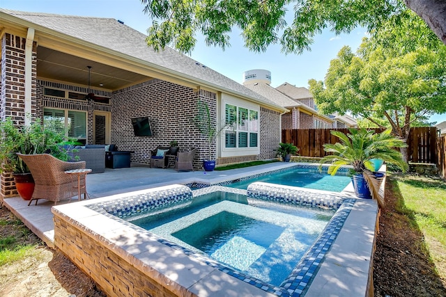 view of swimming pool with a patio, ceiling fan, and an in ground hot tub