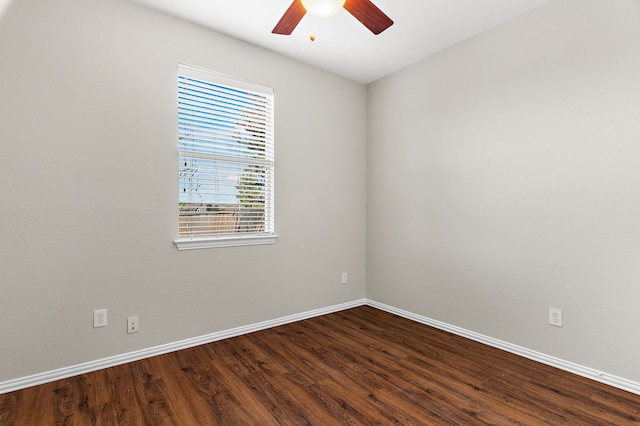 living room with dark wood-type flooring and ceiling fan