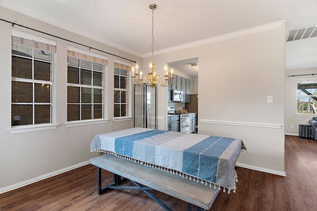 dining room featuring ornamental molding, a healthy amount of sunlight, and dark hardwood / wood-style floors