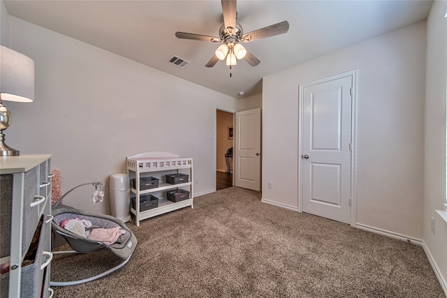 interior space with ceiling fan and carpet floors