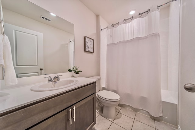 full bathroom with shower / tub combo with curtain, tile patterned flooring, vanity, and toilet