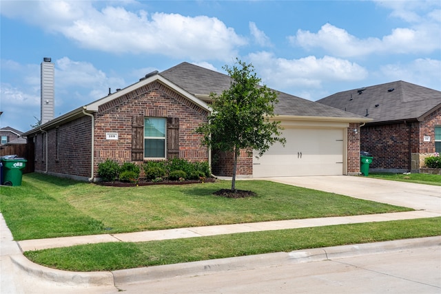 view of front of property with a garage and a front yard