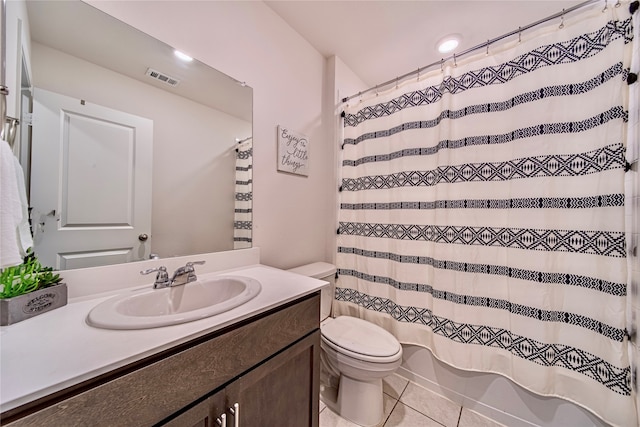 full bathroom featuring shower / tub combo, vanity, toilet, and tile patterned floors