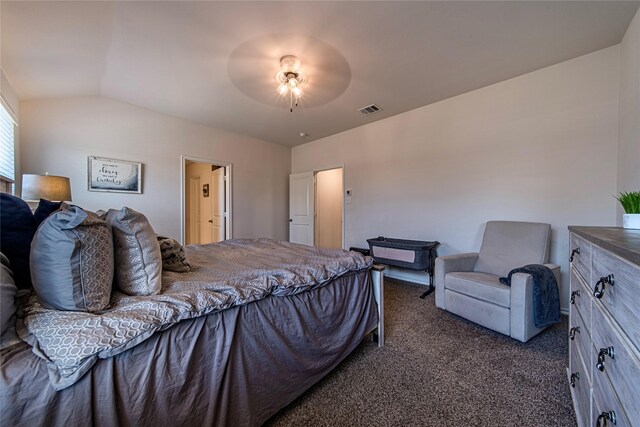 bedroom with ceiling fan, lofted ceiling, and dark colored carpet