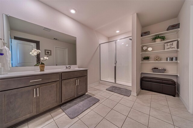 bathroom with vanity, tile patterned floors, and a shower with shower door