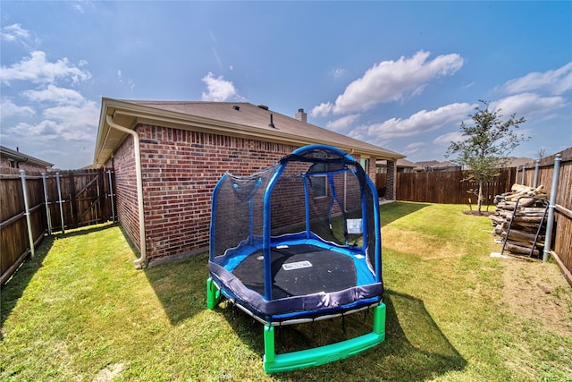 view of yard featuring a trampoline