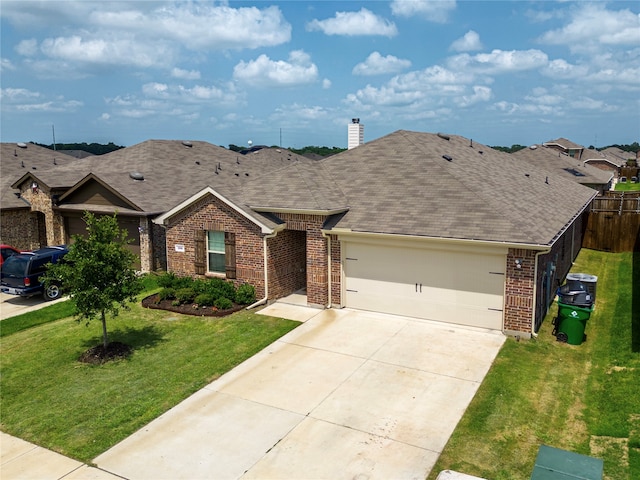 single story home with a garage and a front lawn