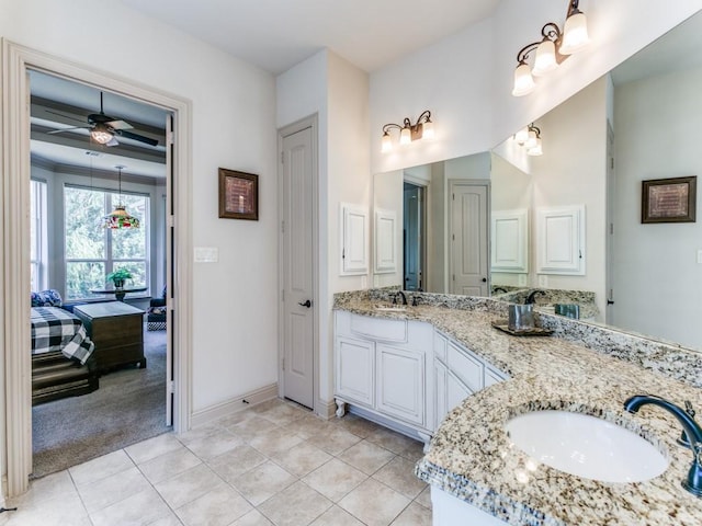 bathroom with ceiling fan, tile patterned flooring, and vanity