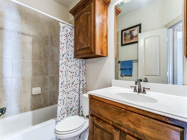 full bathroom featuring shower / bath combo, vanity, and toilet