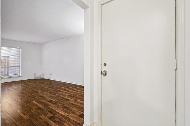 empty room featuring dark hardwood / wood-style floors