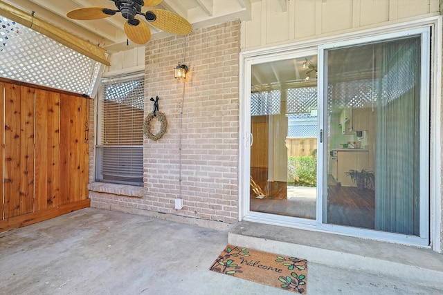 entrance to property featuring ceiling fan