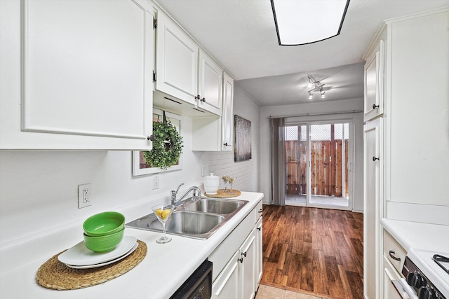 kitchen featuring backsplash, white range, dark wood-type flooring, sink, and white cabinets