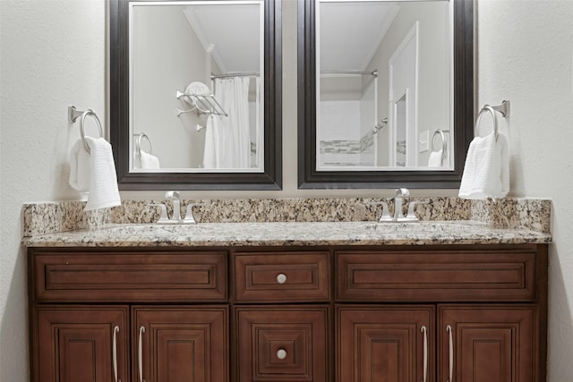 bathroom featuring curtained shower, vanity, and crown molding