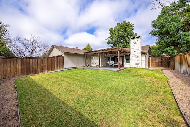 back of property featuring a patio and a yard