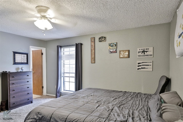 bedroom with a textured ceiling, light carpet, and ceiling fan