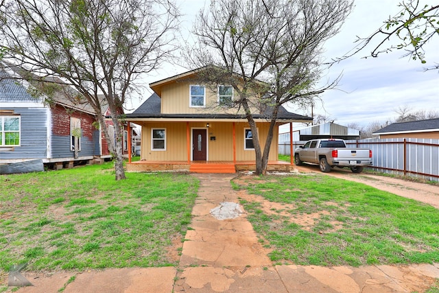 view of front of home featuring a porch and a front lawn