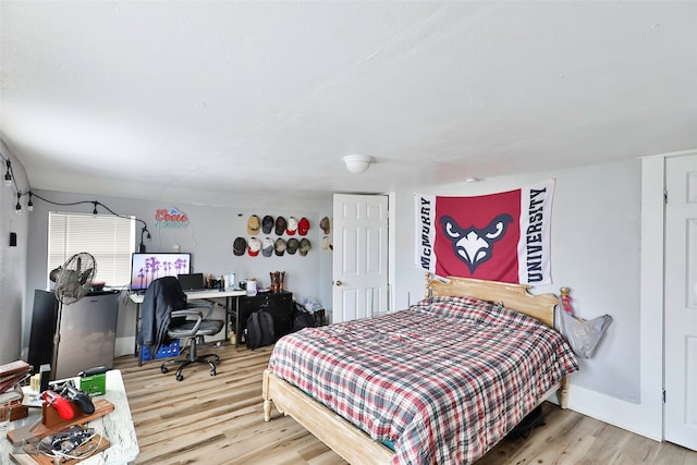 bedroom with hardwood / wood-style flooring