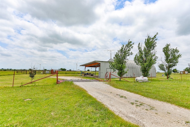 exterior space with a front yard and a rural view