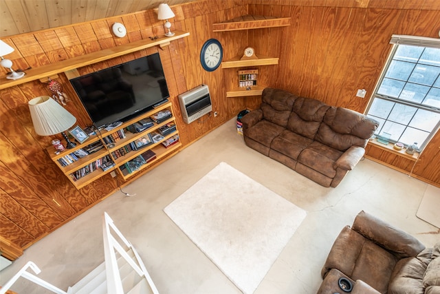 living room featuring heating unit, wooden walls, vaulted ceiling, and wooden ceiling