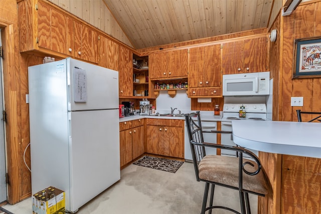 kitchen featuring lofted ceiling, wood walls, white appliances, a breakfast bar, and wooden ceiling