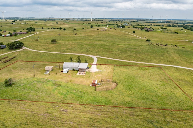 birds eye view of property with a rural view