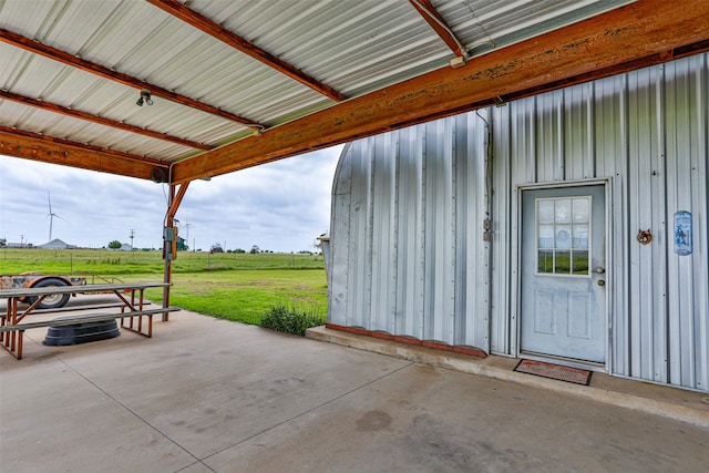 exterior space featuring a rural view and a yard