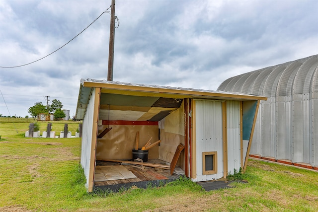 view of outdoor structure with a yard