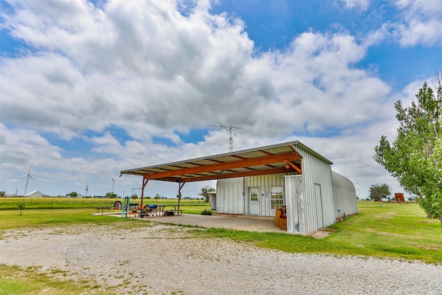 view of outdoor structure featuring a lawn