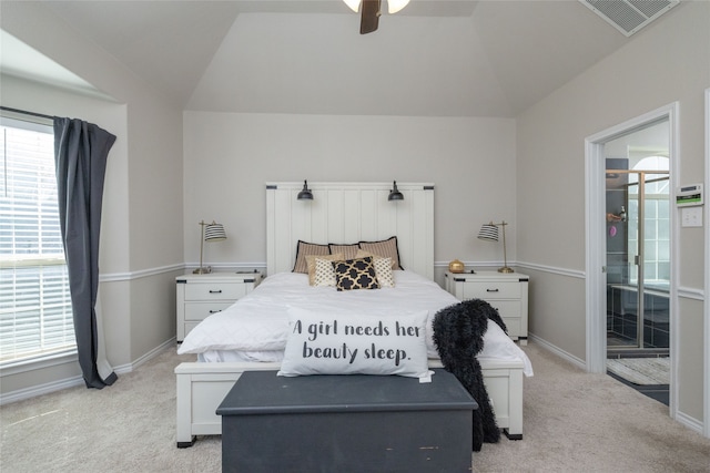 carpeted bedroom with ceiling fan and lofted ceiling