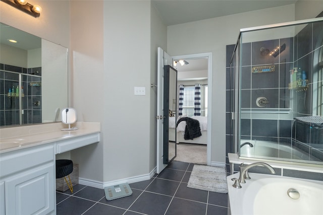 bathroom featuring shower with separate bathtub, tile patterned floors, and vanity