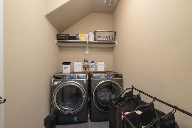 washroom featuring washer and clothes dryer