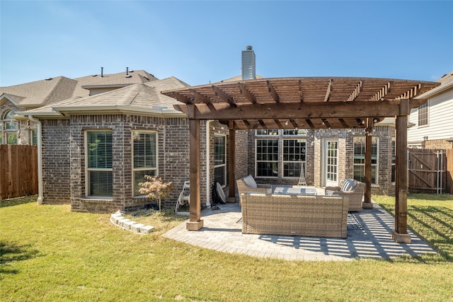 rear view of property featuring a patio area, outdoor lounge area, a yard, and a pergola