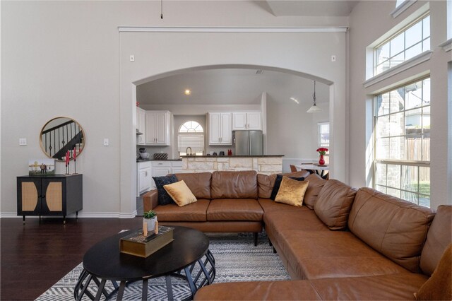 9736 Makiposa Ln, Fort Worth, TX 76177 - living area with dark wood finished floors, arched walkways, and baseboards