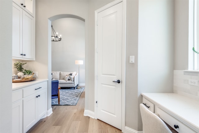 bathroom featuring a chandelier, vanity, and hardwood / wood-style flooring