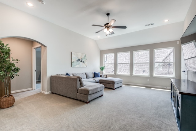 living room with carpet, ceiling fan, and vaulted ceiling