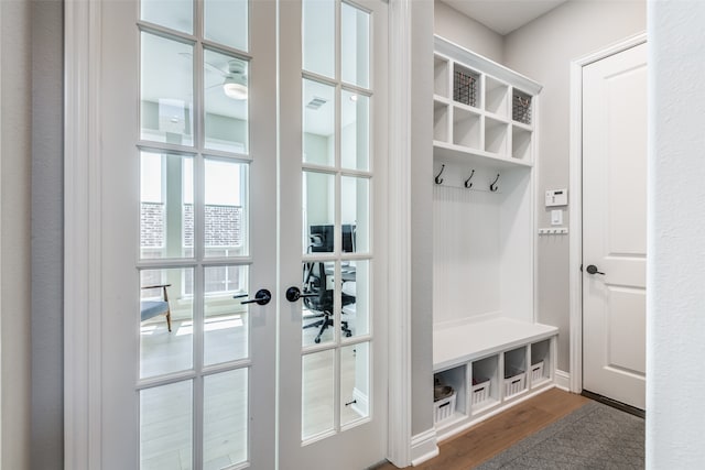 mudroom featuring french doors and hardwood / wood-style flooring