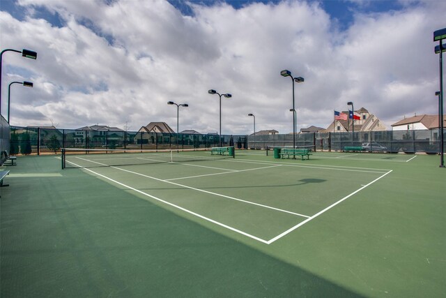 view of sport court with basketball hoop