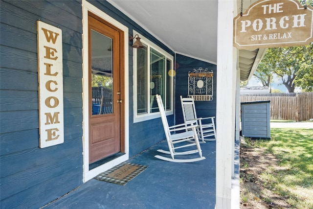 doorway to property featuring covered porch