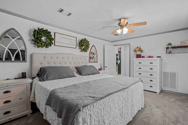 bedroom with ceiling fan, light carpet, a textured ceiling, and ornamental molding