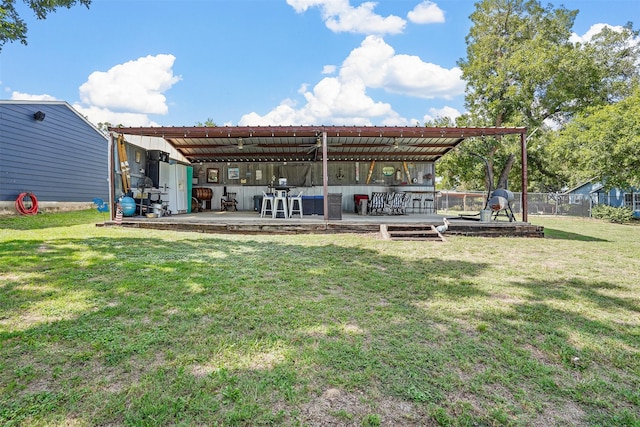 back of house with a patio area and a yard