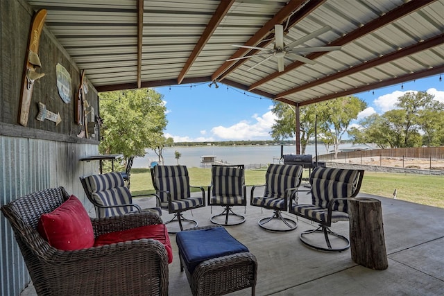 view of patio featuring ceiling fan and a water view