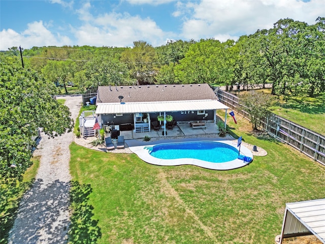 view of pool featuring a lawn, outdoor lounge area, and a patio