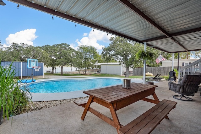 view of pool featuring a patio